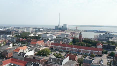 Aerial-view-over-the-city-of-Esbjerg-with-his-harbor-and-the-chimney-of-the-coal-and-oil-fueled-power-plant.-This-chimney-is-the-tallest-in-all-Scandinavia