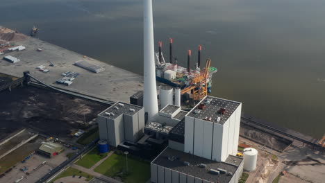 Aerial-view-of-the-power-station-in-Esbjerg,-Denmark.-Drone-view-of-the-Esbjerg-Power-Station,-coal-fired-power-plant-with-goal-of-net-zero-emissions-by-the-year-2025-and-no-carbon-emissions-by-2040
