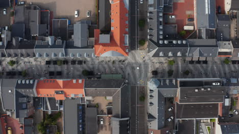 Overhead-view-of-Torvegade-in-Esbjerg,-one-of-Denmark's-longest-pedestrian-avenue.-Top-down-view-panning-with-pedestrian-strolling-downtown-and-tourist-enjoying-sightseeing