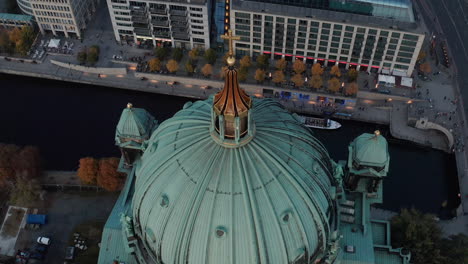 Ascending-over-roof-of-church-view.-Stunning-footage-of-green-dome-of-Berlin-Cathedral-against-riverbank-and-Spree-river.-Berlin,-Germany.