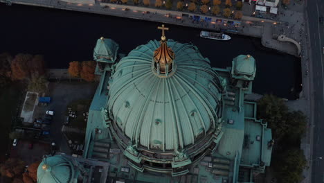 Aerial-view-from-ascending-drone-on-Berlin-Cathedral-roof.-Large-green-dome-and-four-turrets-in-corners-of-church.-Berlin,-Germany.