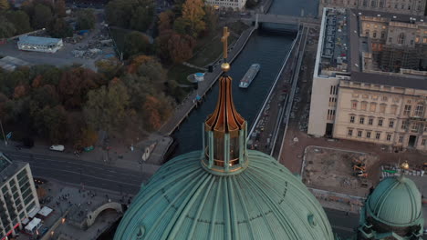 Panning-aerial-view-of-Berlin-Palace,-Spree-river-and-park-at-dusk.-View-from-dome-of-Berlin-Cathedral.-Berlin,-Germany.
