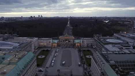 Crowd-of-people-visiting-famous-landmark.-Aerial-view-of-Brandenburger-Tor-and-park-behind.-Berlin,-Germany