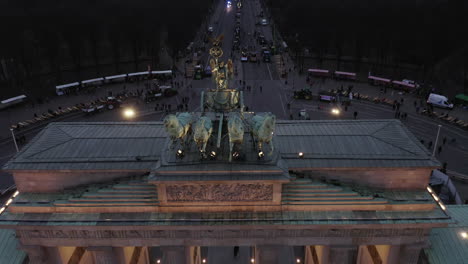 Close-up-of-quadriga-sculpture-on-top-of-Brandenburger-Tor.-Aerial-descending-footage-of-chariot-drawn-by-four-horses.-Berlin,-Germany