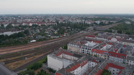 Forwards-descending-footage-of-empty-main-multitrack-railway-line-leading-through-large-city.-Berlin,-Germany