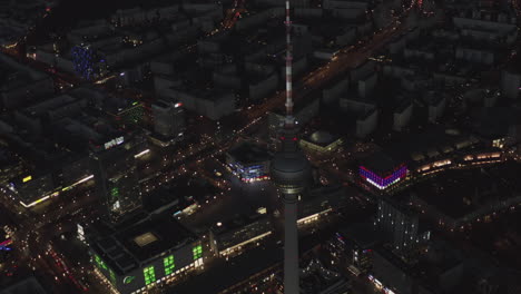 Aerial-Establishing-Shot-of-Berlin-German-TV-Tower-and-Alexanderplatz-at-Night,-Wide-Drone-view
