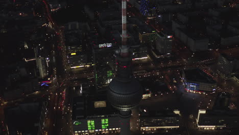 Incredible-Scenic-Night-View-over-Alexanderplatz-and-Berlin-TV-Tower-at-Night-with-traffic-lights,-Cinematic-Aerial-shot