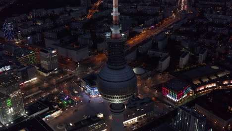 Amazing-View-of-Stunning-Skyscraper-in-Urban-City-Center-surrounded-by-City-light-and-Streets-with-Buildings-in-Berlin,-Germany,-Aerial-Establishing-Wide-Angle-Shot