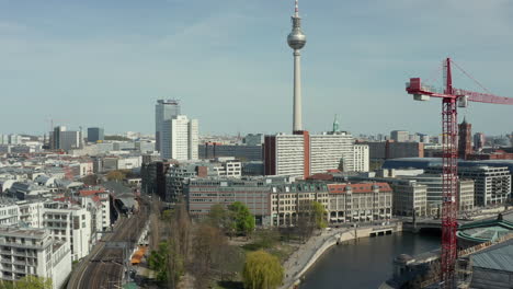 AERIAL:-Wide-View-of-Empty-Berlin-with-Spree-River-and-Train-Tracks-with-View-of-Alexanderplatz-TV-Tower-During-COVID-19-Coronavirus