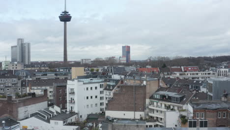 Multistorey-apartment-buildings-in-urban-borough-and-tall-Colonius-telecommunications-tower-in-background.-Cologne,-Germany