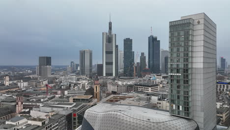 Fly-around-shopping-centre-MyZeil-in-urban-neighbourhood.-Modern-office-towers-in-business-borough-in-background.-Frankfurt-am-Main,-Germany