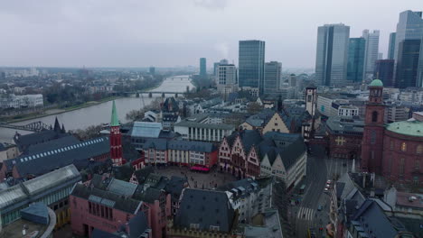 Fly-above-historic-city-centre.-Medieval-coloured-buildings-around-Roemerberg.-Tourists-visiting-sights.-Frankfurt-am-Main,-Germany