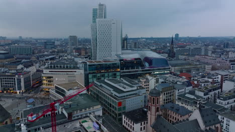 Aerial-view-of-buildings-in-city-centre-at-twilight.-Mixture-of-historic-and-modern-development.-Shopping-galleries-along-Zeil-street.-Frankfurt-am-Main,-Germany