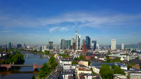 AERIAL:-Towards-Frankfurt-am-Main,-Germany-with-Main-River-on-beautiful-Sunny-Day