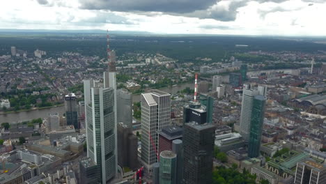 AERIAL:-Spectacular-View-over-Frankfurt-am-Main,-Germany-Skyline-Skyscraper-Roofs-on-Cloudy-Overcast-Day
