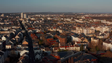 Aerial-drone-view-of-urban-neighbourhood.-Buildings-illuminated-by-bright-morning-sun.-Frankfurt-am-Main,-Germany