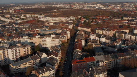Aerial-drone-view-of-urban-neighbourhood.-Slowly-forward-moving-view-tilting-down-to-show-crossroad.-Frankfurt-am-Main,-Germany