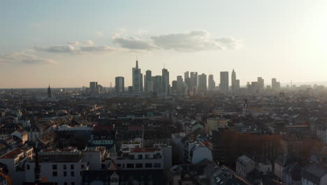 Aerial-view-of-cityscape-with-skyscrapers.-Elevated-view-form-drone-on-skyline-against-bright-sky.-Frankfurt-am-Main,-Germany