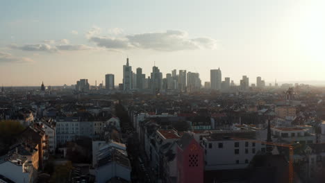 Rooftop-view-of-urban-neighbourhood.-Skyline-with-skyscrapers-against-bright-sky-from-drone.-Frankfurt-am-Main,-Germany