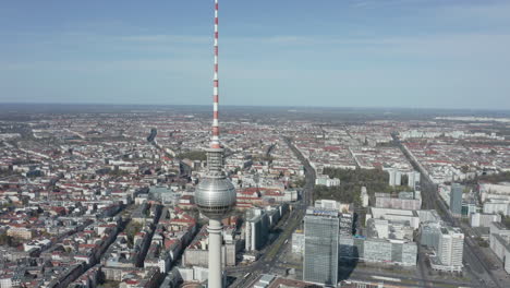 AERIAL:-Wide-View-above-Alexanderplatz-TV-Tower-in-Empty-Berlin-on-Sunny-Day