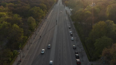 AERIAL:-Strasse-des-17.-Juni-in-Berlin,-Germany-Empty-because-of-Coronavirus-COVID-19-Pandemic-in-Beautiful-Sunset-Light