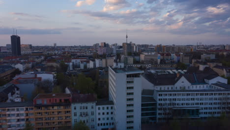 AERIAL:-Beautiful-Sunset-Drone-Hyper-Lapse,-Motion-Time-Lapse-over-Berlin-Cityscape-with-Alexanderplatz-TV-Tower-view-and-Blue-Sky-with-Clouds