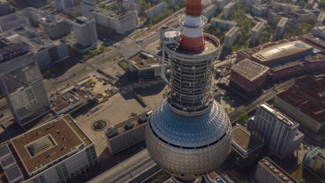 AERIAL:-Fast-Drone-Hyper-Lapse,-Motion-Time-Lapse-Circling-Alexanderplatz-TV-Tower-in-Berlin,-Germany-in-bright-Summer-Day