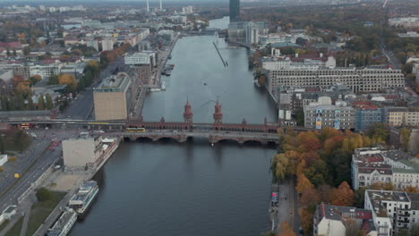 Oberbaum-Bridge-on-Spree-River-in-Berlin,-Germany-at-Daytime,-Aerial-Dolly-Truck-Slide-Right