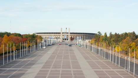 Olympiastadion-in-Berlin,-Germany-with-no-people-during-Coronavirus-Covid-19-Pandemic,-Aerial-Wide-Shot-Dolly-forward-establishing-Shot,-October-2020