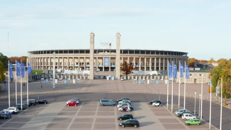 Parking-lot-in-front-of-Stadium-in-Berlin,-Germany,-Aerial-Wide-Shot-Dolly-forward-establisher,-October-2020
