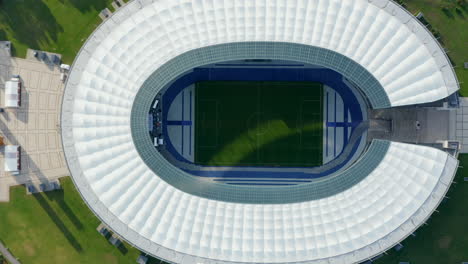 Birds-Eye-Overhead-Top-Down-Aerial-View-of-Football-White-Stadium-with-green-grass-in-Berlin,-Germany,-Drone-perspective-from-above,-October-2020
