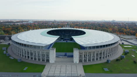 Berlin,-Germany-Soccer-Football-Stadium-Establishing-Shot,-slow-Aerial-slide-right-on-beautiful-day-in-Fall,-October-2020