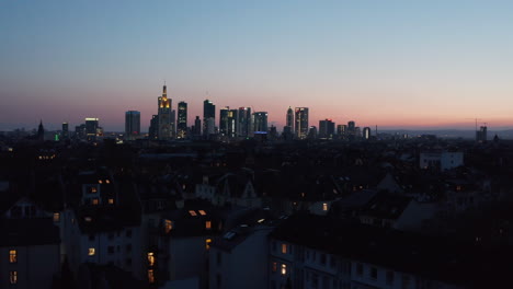 Elevated-evening-cityscape-from-drone-in-blue-hour.-Downtown-panorama-with-skyscrapers-against-pink-blue-sunset-sky.-Frankfurt-am-Main,-Germany
