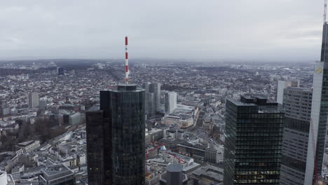Upper-storeys-of-tall-high-rise-business-buildings-towering-high-above-town.-Cityscape-in-background.-Frankfurt-am-Main,-Germany