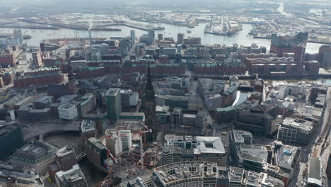 Aerial-view-of-Hamburg-city-center-with-St.-Nikolai-Memorial-church-ruins-among-residential-houses-by-the-river