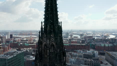 Close-up-aerial-orbit-of-old-gothic-St-Nikolai-world-war-Memorial-church-ruins-in-Hamburg-city-center