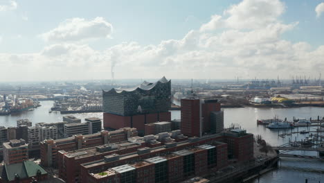 Aerial-dolly-view-of-modern-Elbphilharmonie-concert-hall-building-by-Elbe-river-in-Hamburg