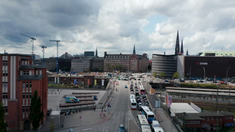 Forwards-fly-above-heavy-traffic-on-main-thoroughfares-in-town.-Busy-multilane-intersection-in-rush-hour.-Free-and-Hanseatic-City-of-Hamburg,-Germany