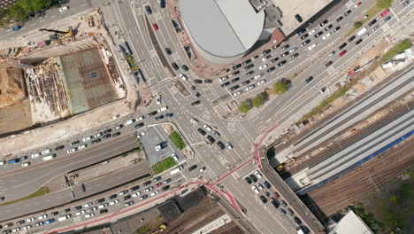 Aerial-birds-eye-overhead-top-down-view-of-traffic-in-town-streets-in-rush-hour.-Cars-driving-through-road-intersection.-Free-and-Hanseatic-City-of-Hamburg,-Germany