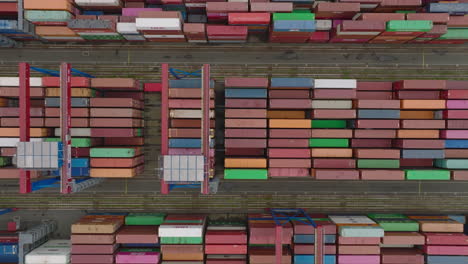 Birds-eye-shot-of-intermodal-transport-terminal.-sorting-containers-and-waiting-for-delivering-to-final-customer.-Hamburg,-Germany