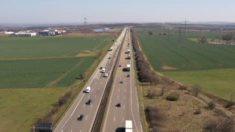 Aerial-drone-hyperlapse-of-busy-highway-traffic-on-German-Autobahn-multi-lane-road,-Hyper-Lapse-Time-Lapse