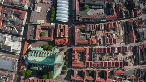 Aerial-birds-eye-overhead-top-down-panning-view-of-historic-town-centre-with-St.-Marys-Church.-Luebeck,-Schleswig-Holstein,-Germany