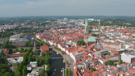 Aerial-shot-of-old-town-centre.-View-of-Holstentor,-Marienkirche-and-several-other-churches.-Luebeck,-Schleswig-Holstein,-Germany