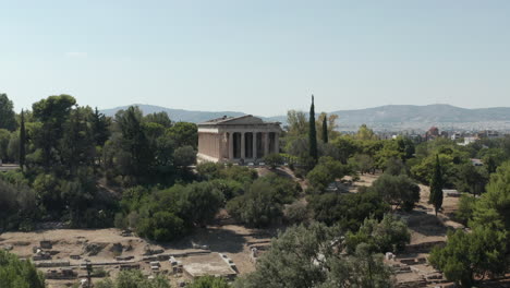 Slow-Aerial-Dolly-movement-towards-typical-Greek-temple-ruins-in-Athens,-Greece-at-Daylight