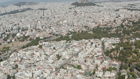 Amplia-Vista-Aérea-De-Drones-Sobre-Atenas,-Paisaje-Urbano-De-Grecia-A-La-Luz-Del-Día