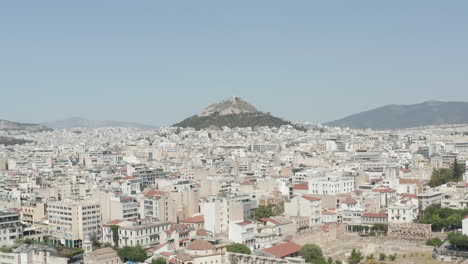Slow-Establishing-Dolly-Aerial-towards-Mount-Lycabettus-in-Athens,-Greece