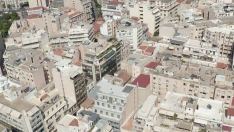 Aerial-Overhead-Top-Down-view-of-City-Apartment-Buildings-and-Streets-in-Summer-Daylight