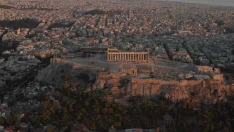 Aerial-Perspective-circling-Acropolis-of-Athens-in-Golden-Hour-Sunset-Light