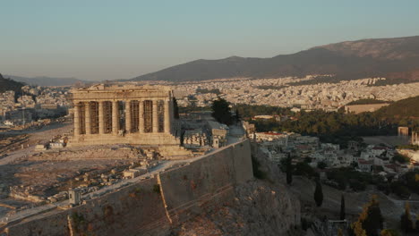 Acropolis-of-Athens-in-Construction-during-beautiful-Golden-Hour-in-Summer-Aerial