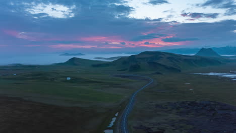 Forwards-fly-above-tranquil-morning-preserved-landscape-in-Iceland.-Aerial-hyper-lapse-footage-of-clouds-floating-on-twilight-sky-and-fog-flooded-valleys-in-distance